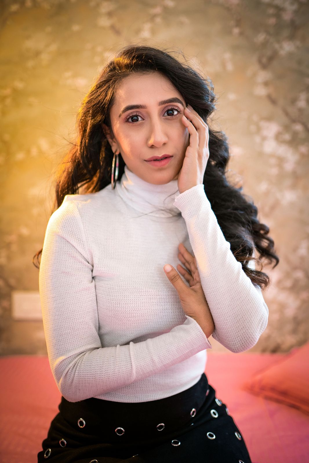 Suman — portrait against the gold wall