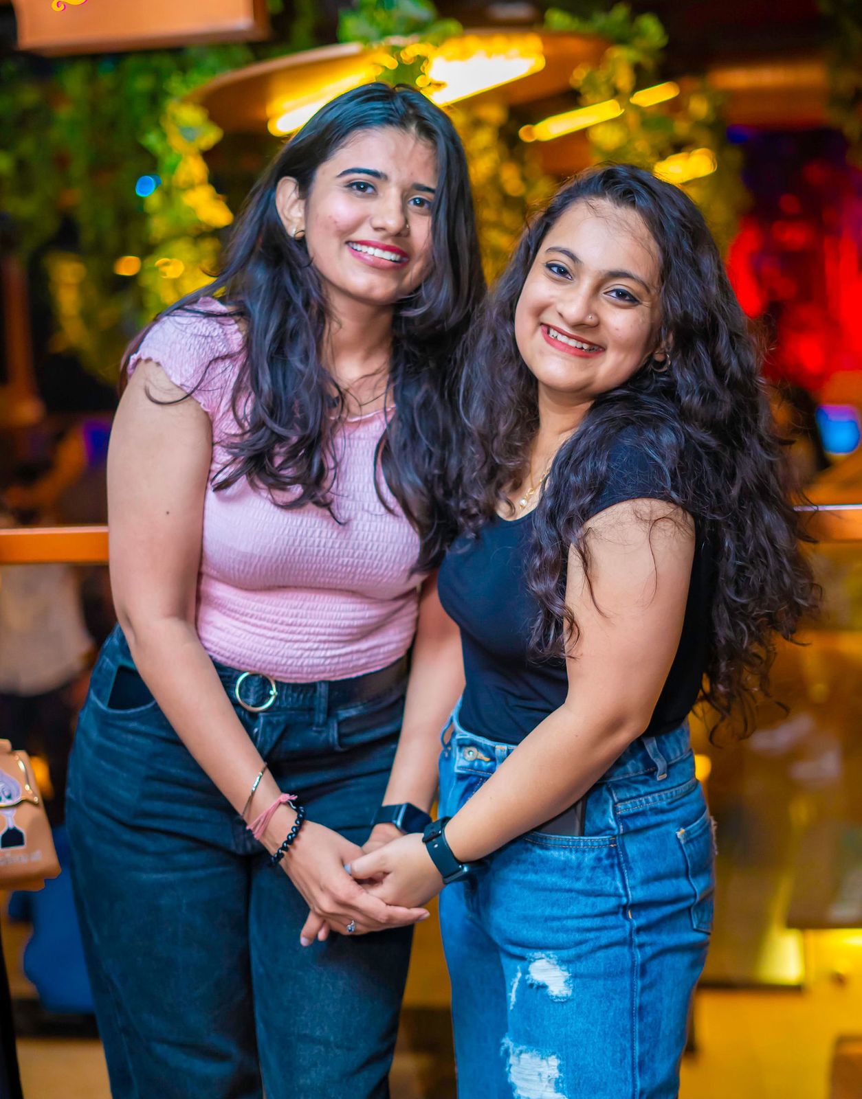 Night out — two friends, hands together
