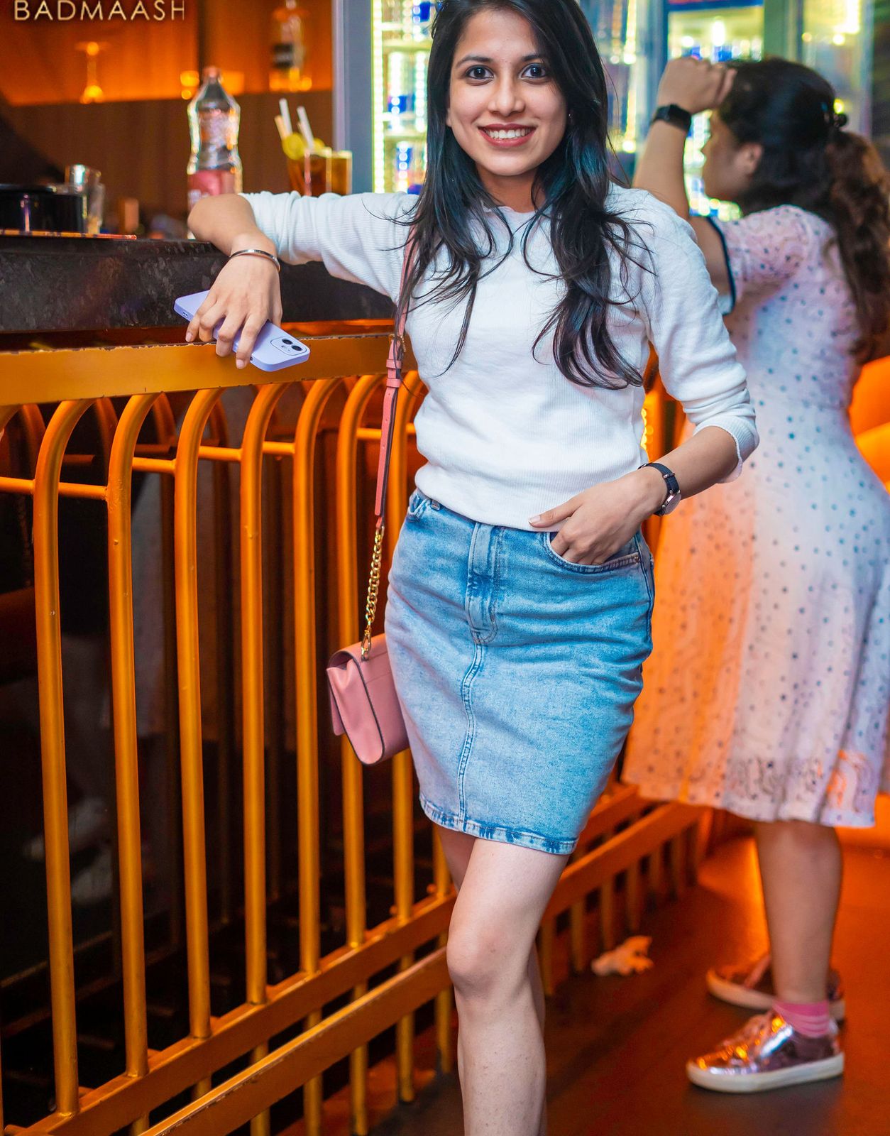 Night out — denim at the balcony rail