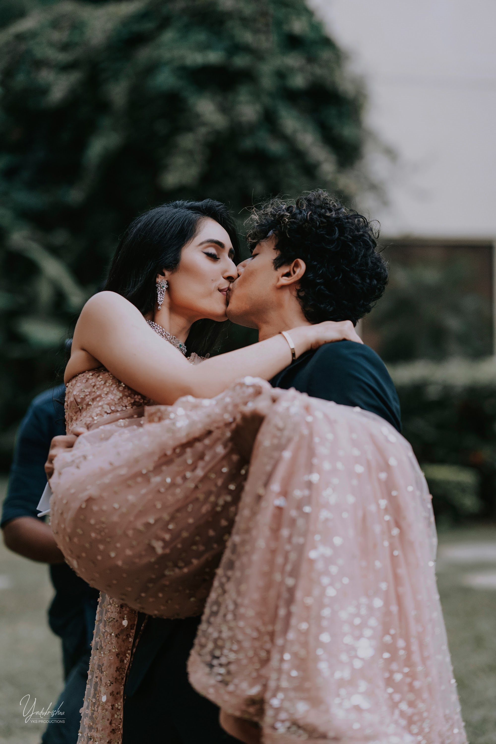 Groom lifting the bride