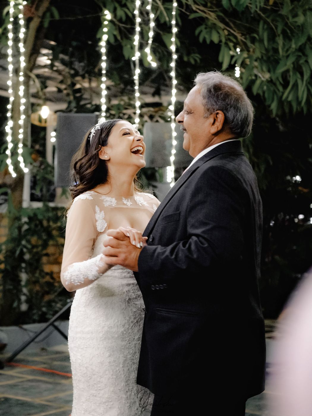 Father-daughter dance at a garden wedding