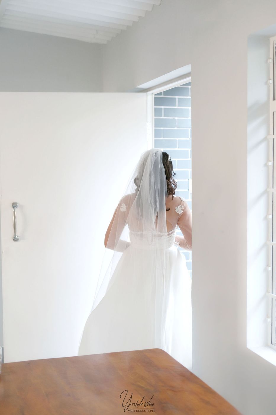 Bride at the window, getting ready
