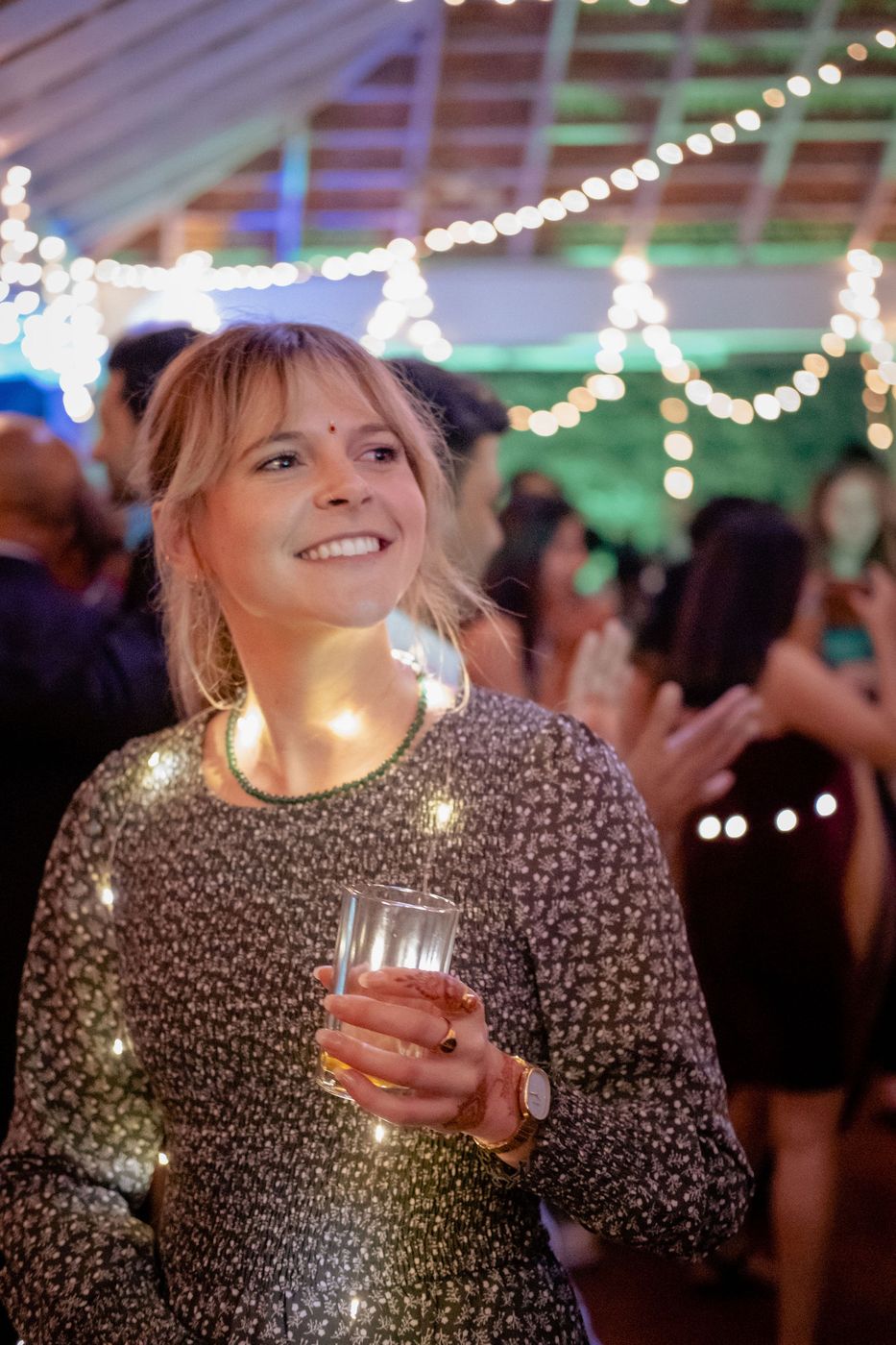 Guest smiling under the lights