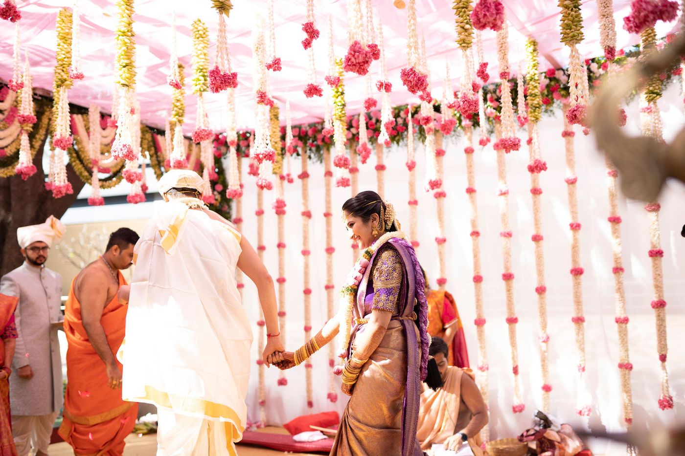 Bride and groom under the canopy